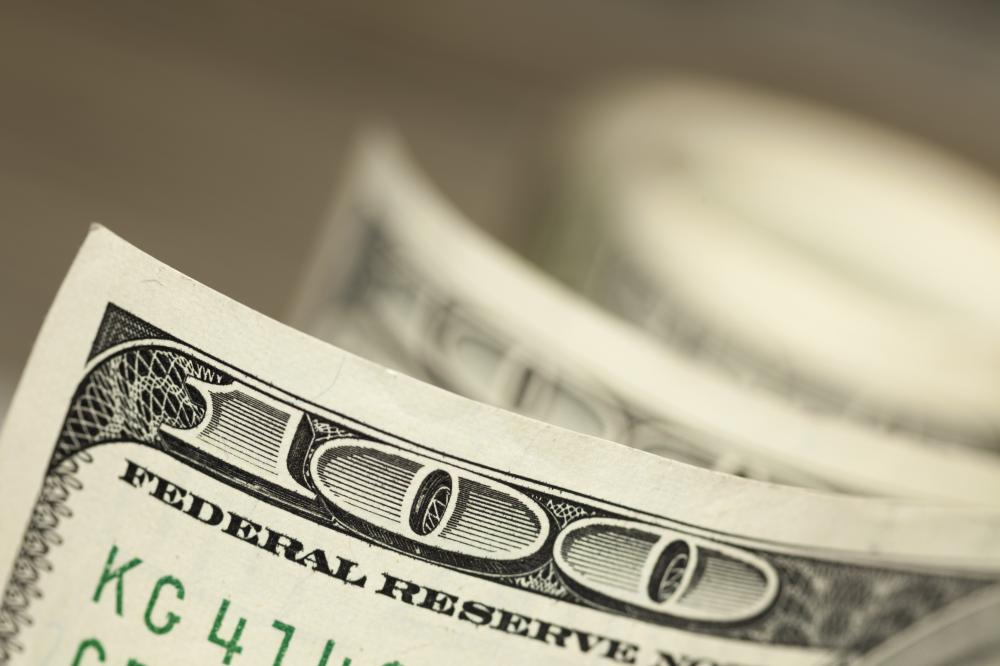 Larger bills are usually hidden under the cash drawer.