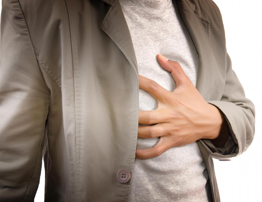 Chest pain and pressure along with shortness of breath can be symptoms of a heart attack.