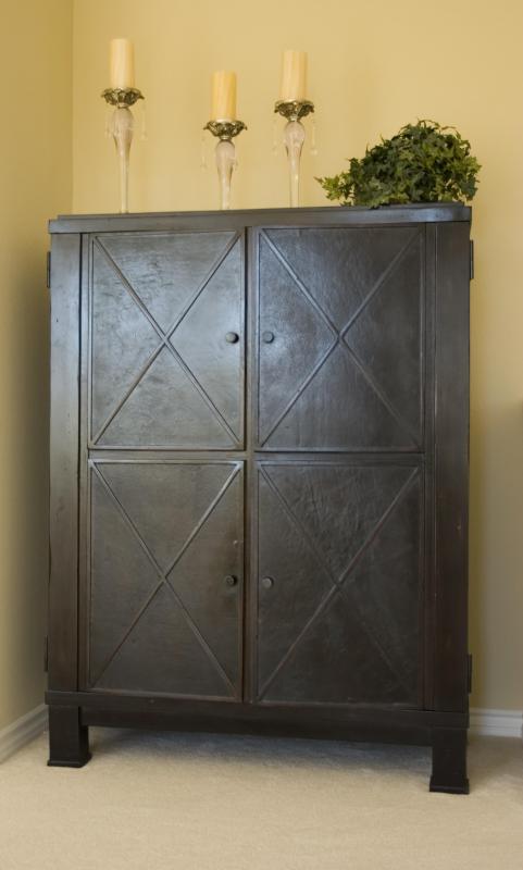 Armoires are typically larger and more detailed than wardrobes.