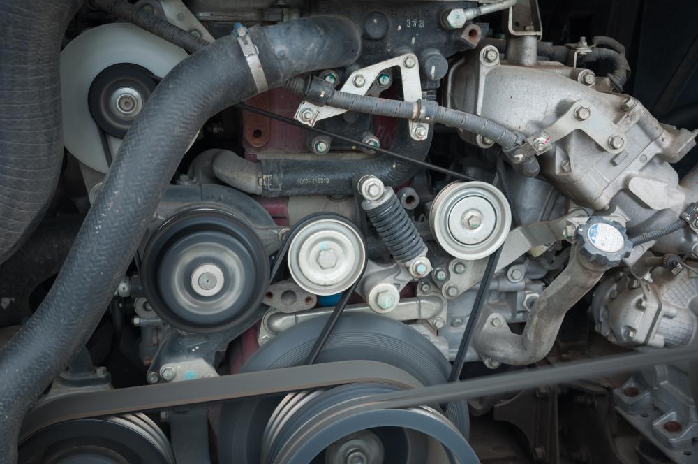 Automobile engine idler pulleys help regulate how the belts run from the crankshaft.