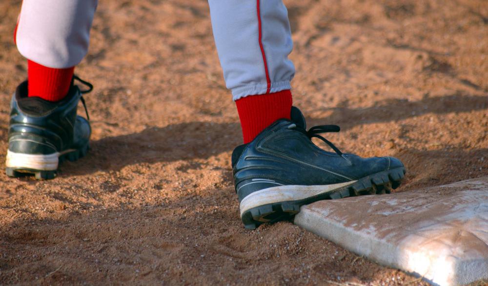 When a batter strikes a ball and safely reaches first base without any aid, it is considered a hit.