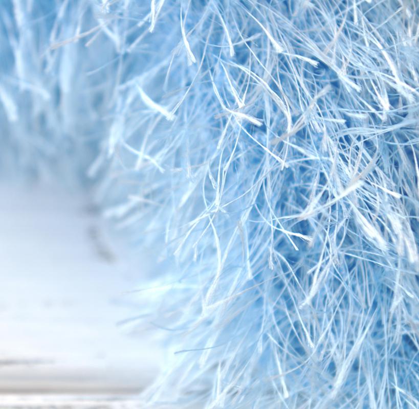 Eyelash yarn consists of an abundance of short threads coming away from a central thread of yarn.