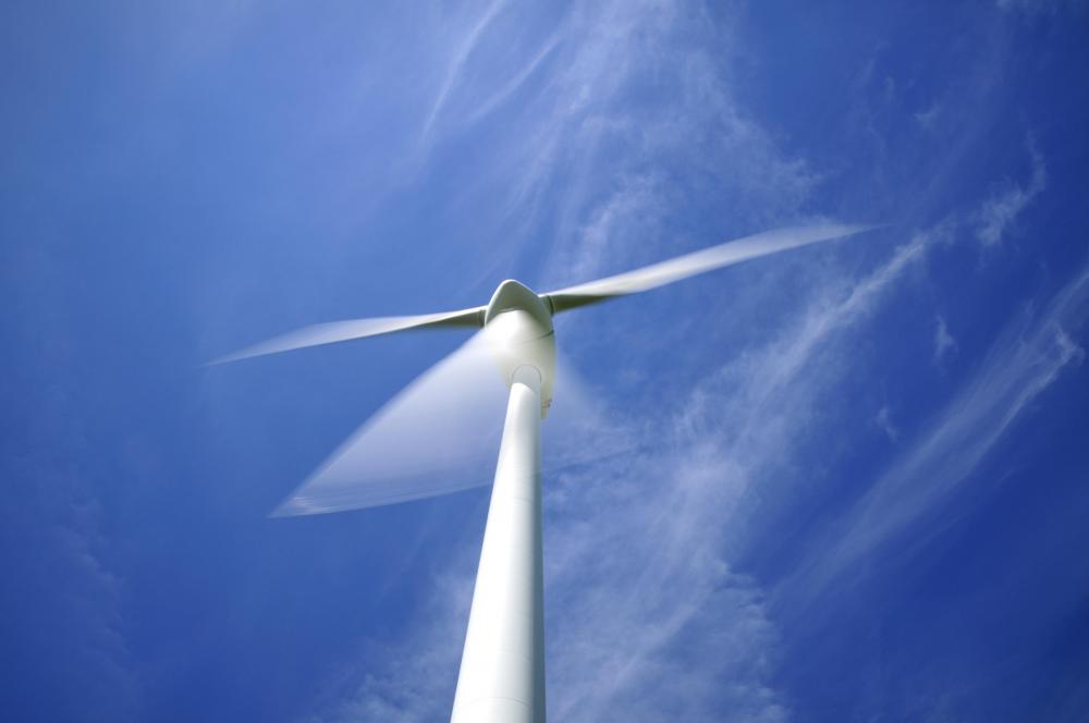 A television without Auto Motion Plus technology would show a somewhat blurred image of a fast-moving wind turbine.