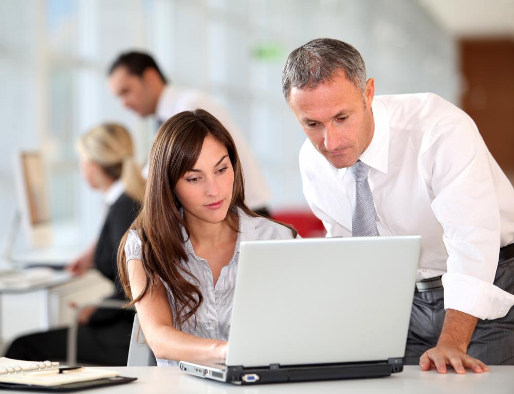 Employees working together, a key aspect to the business concept of participative leadership.