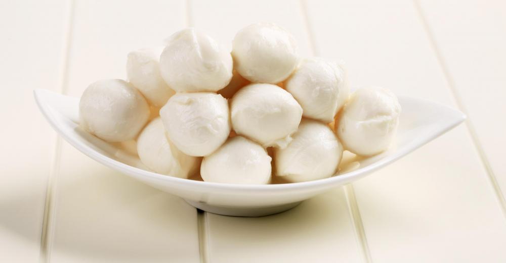 A bowl of bocconcini, small balls of fresh mozzarella.