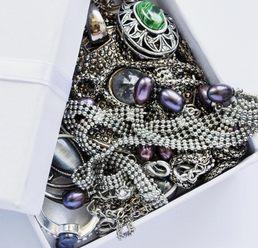 Estate assets, such as jewelry, are distributed to heirs during the probate process.