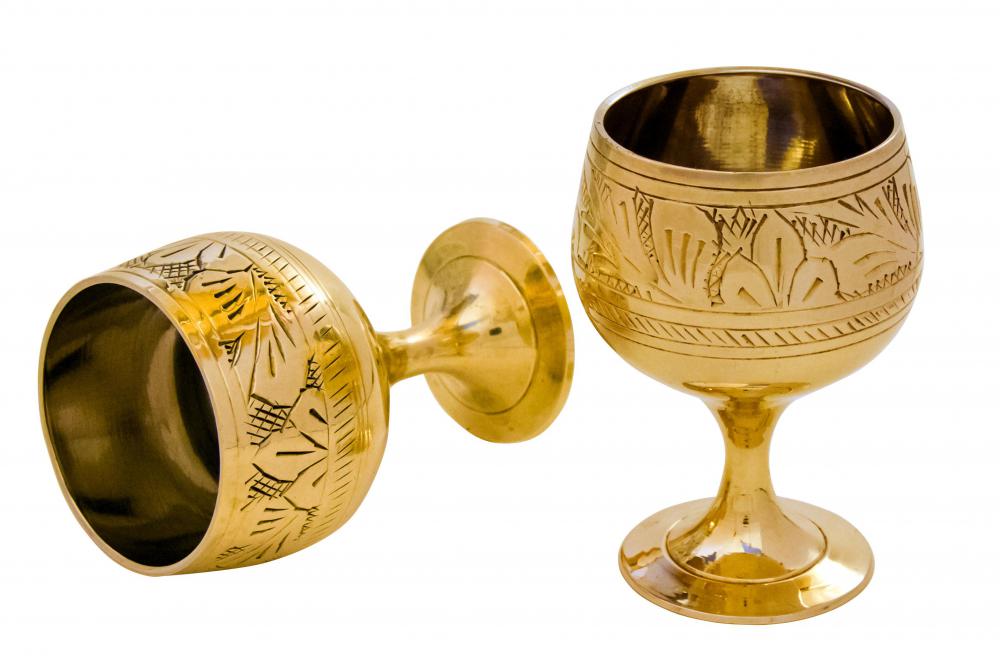 Luxury engraved brass wine glasses.