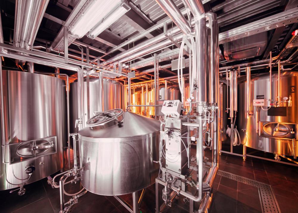 Sodium hydroxide is used to clean large vats and tanks in breweries.