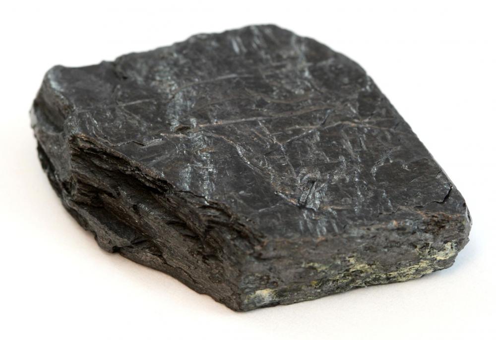 A piece of carbon, which is used to make carbon anodes.