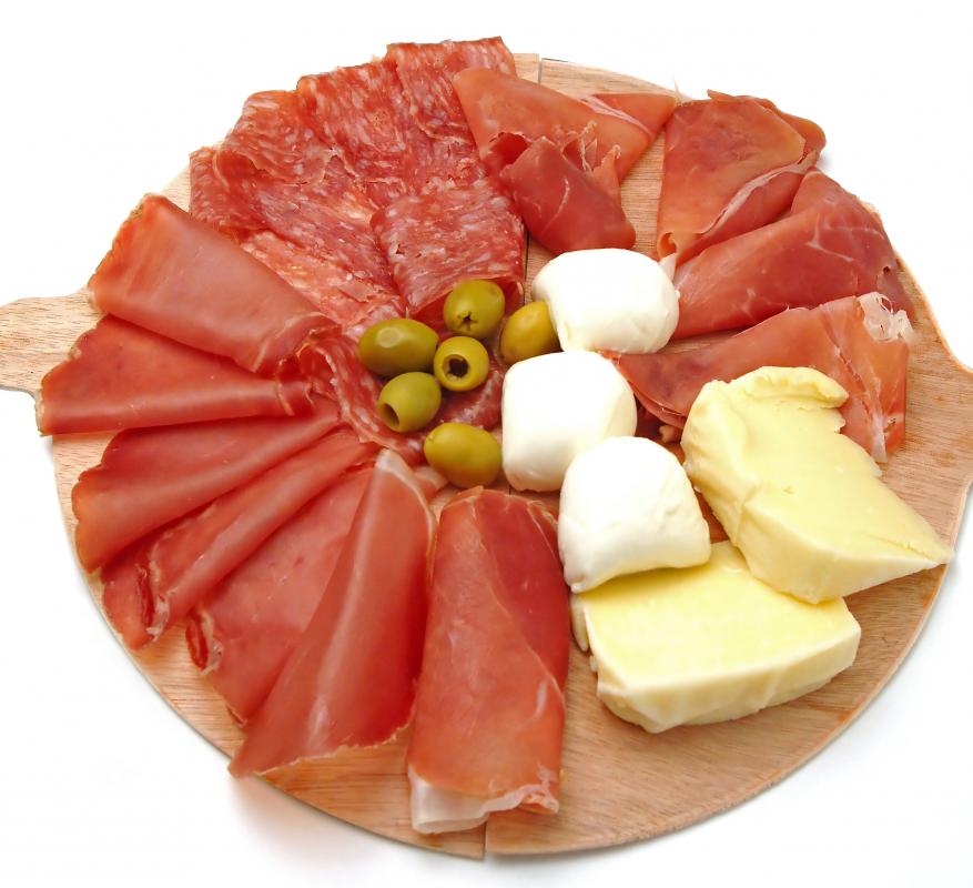 An appetizer platter including mozzarella.