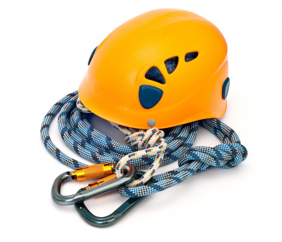 Climbing equipment, including a helmet, rope, and carabiners.