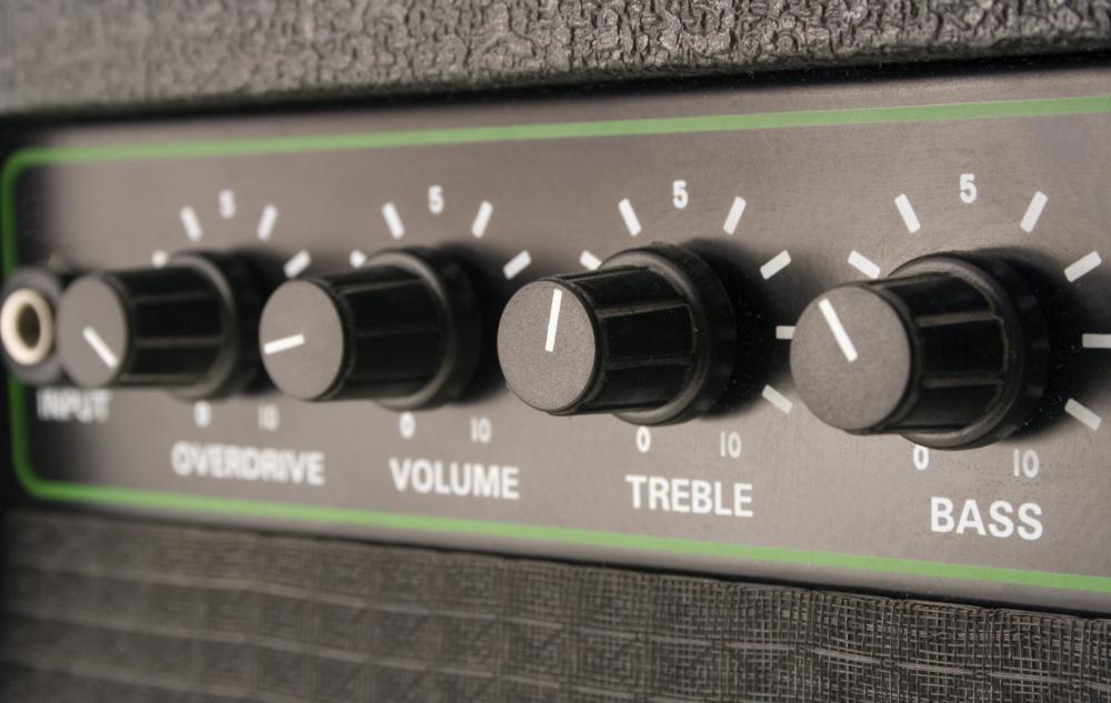 Heavy metal is played on guitars through amplifiers with heavy distortion.