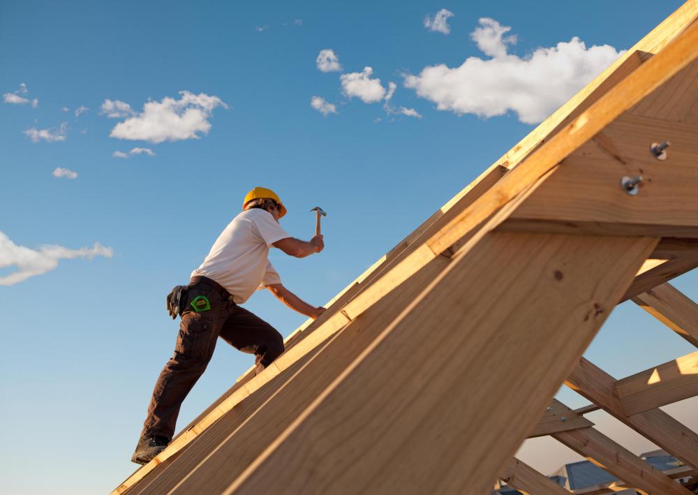 Construction worker on roof.