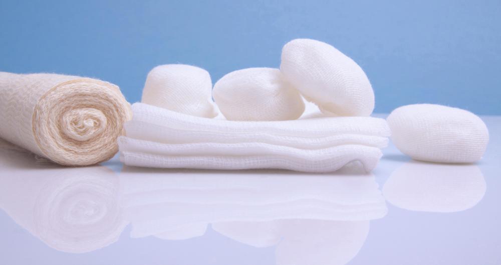 Cotton balls may be used to clean pus from a bite wound, and bandages may be used to prevent additional contaminants from entering the wound.