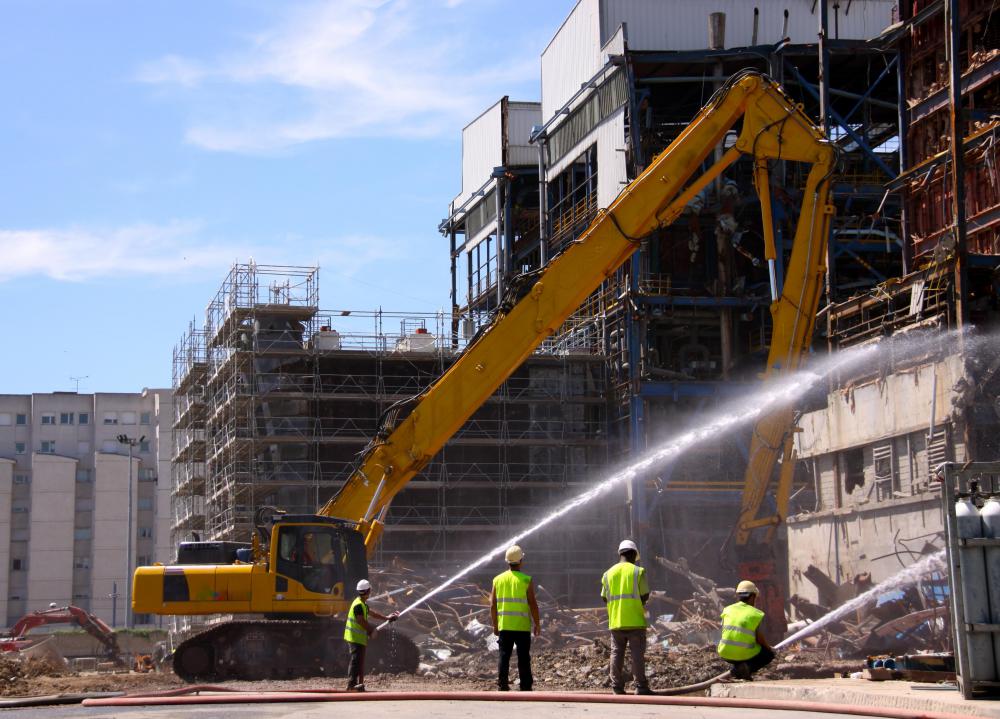 Damaged infrastructure is cleared and rebuilt during the recovery phase of a disaster.