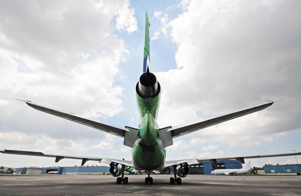An aircraft typically climbs or descends by using the elevator controls on the tail to pitch the nose up or down.