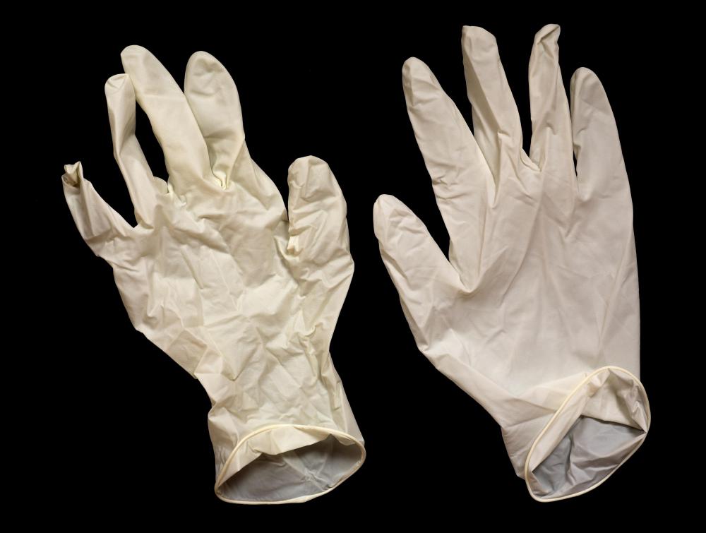 Use gloves to protect your hands when acid washing jeans.