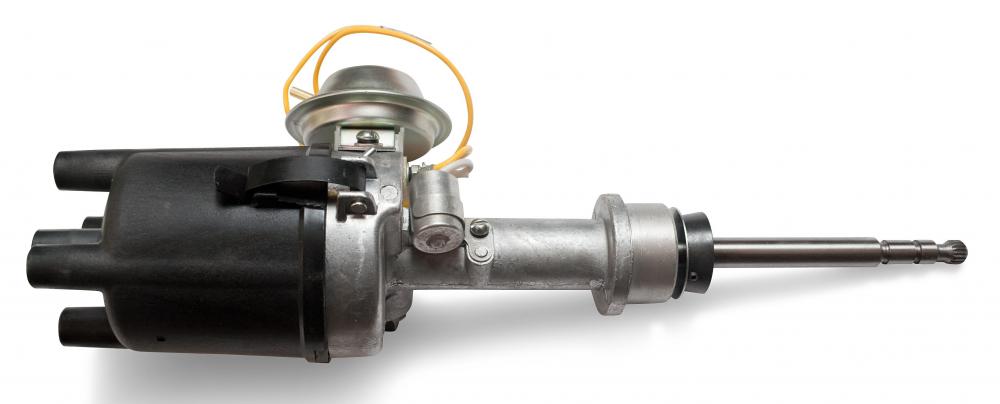 A distributor distributes electricity to the spark plugs and engine.