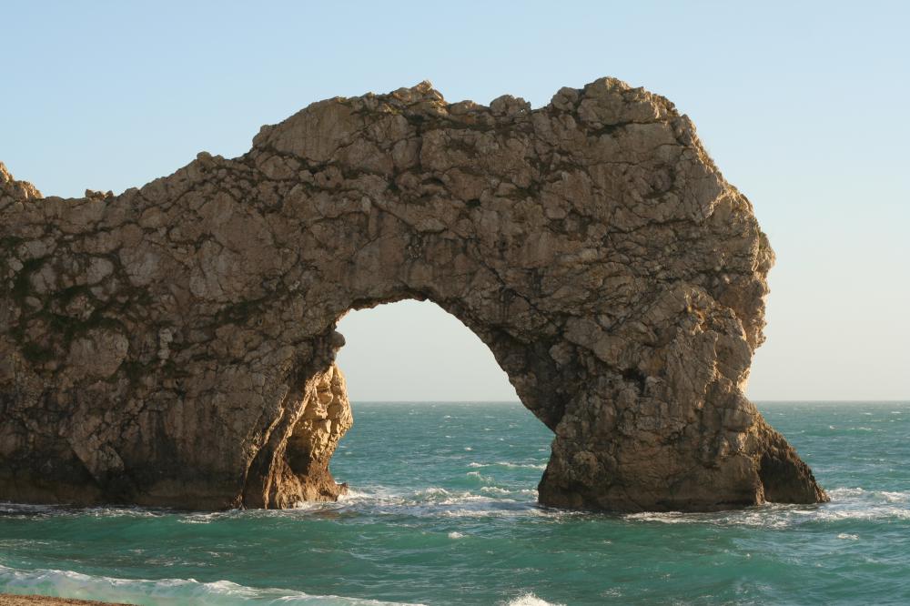 The Durdle Door sea arch formed as the ocean eroded limestone along the coast of southern England.