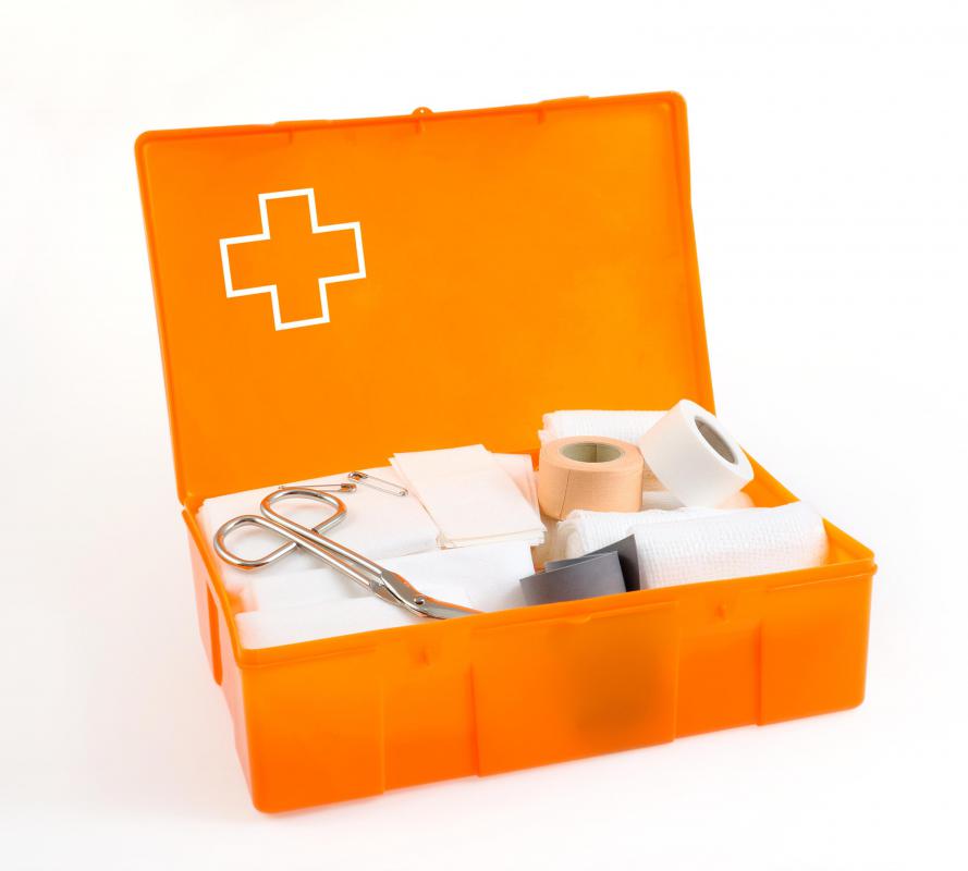 An emergency kit with bandages, scissors, gloves, and painkillers can be found in many grocery stores.