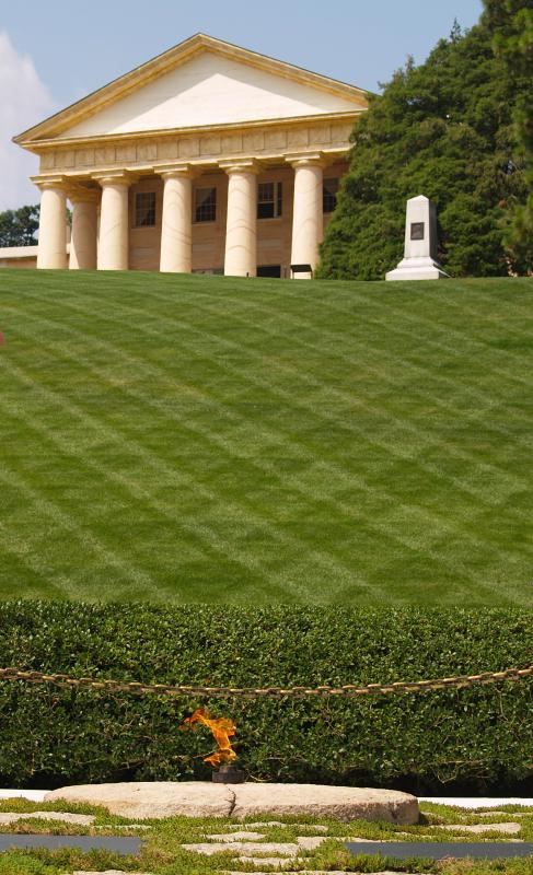 The grave site of assassinated President John F. Kennedy is lit by an eternal flame.