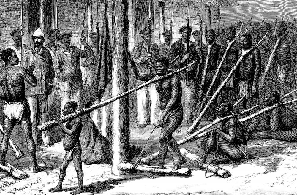 At the end of the first leg of the triangular trade, European merchants used manufactured goods to purchase slaves from native African chiefs and dealers.