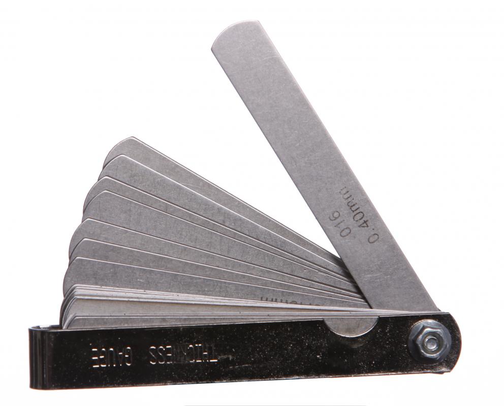 A feeler gauge may be used to measure the amount of clearance between the side of the thrust bearing and crankshaft.