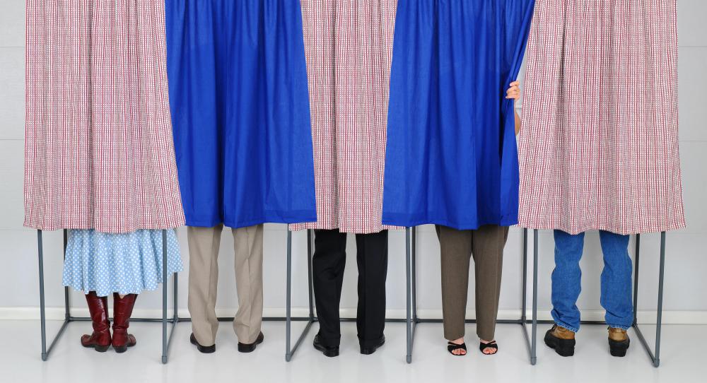 Voting booths provide privacy for people casting votes.