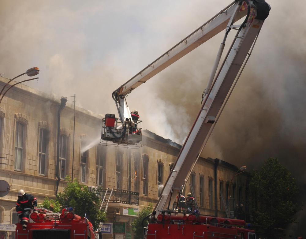 Boom trucks are vehicles that have a long, foldable arm that may be used to lift workers to the top of a phone or electrical pole, or to a high roofline.