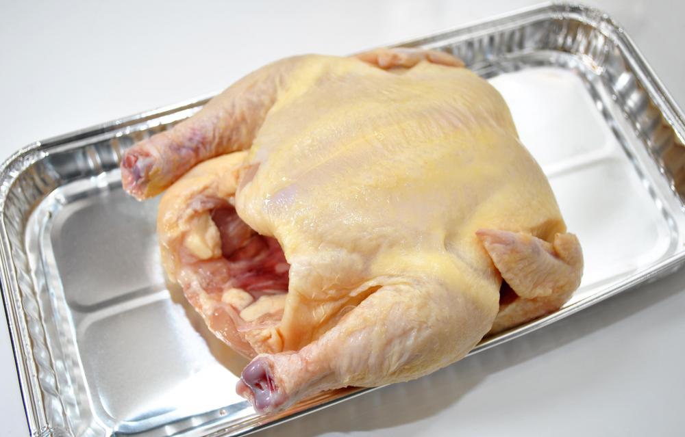 Chicken feathers are removed by placing the dead bird into a rotating drum outfitted with rubber-like fingers that remove feathers through abrasion.