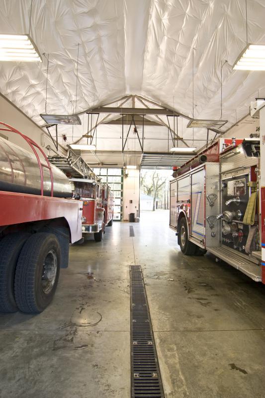 A garage sump pit catches and stores hazardous materials.