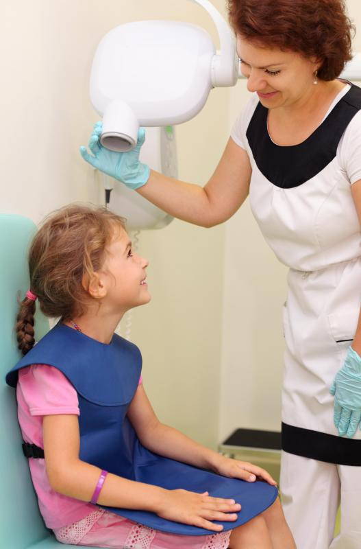 A dentist might ask a parent to sign a consent form before proceeding with treatment on a child.