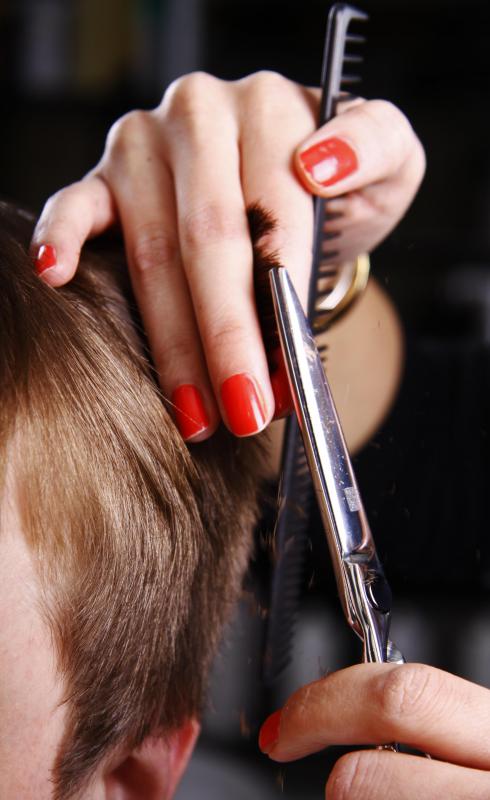 Both men and women go to a hair salon to have their hair cut.