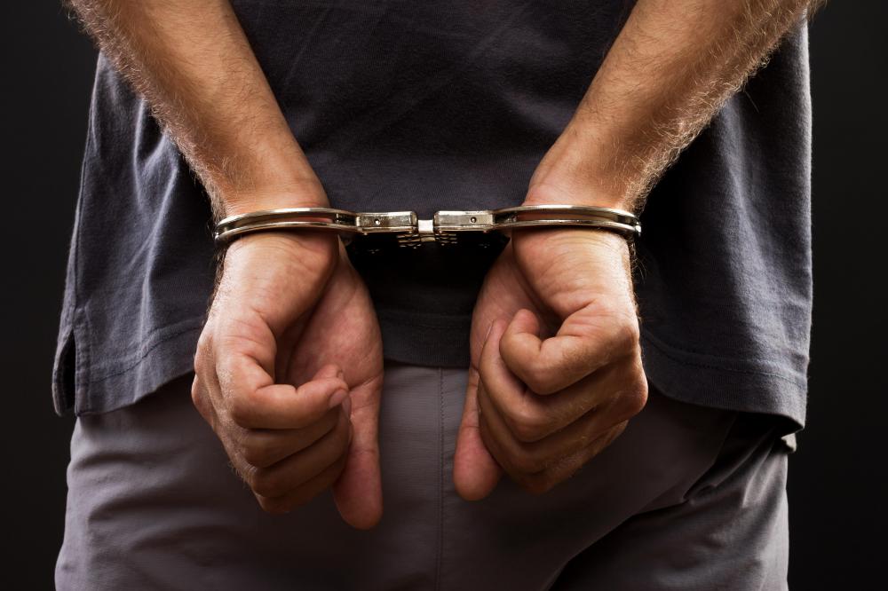 Police officers typically carry handcuffs to detain suspects.