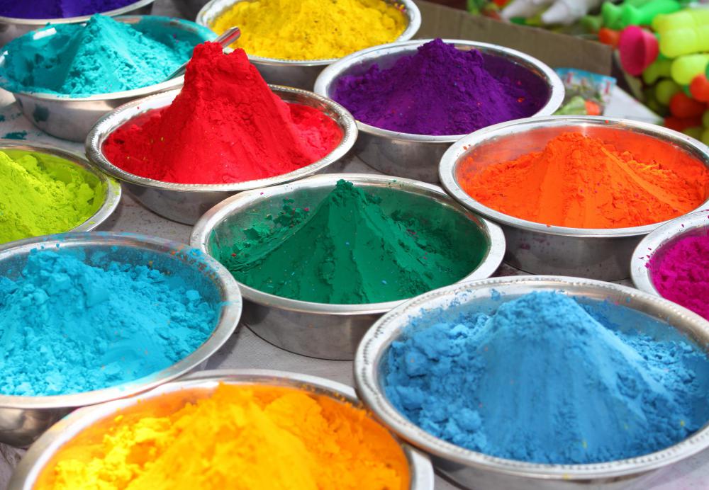 During Holi, a festival celebrating color, people throw colored powder and water at each other.
