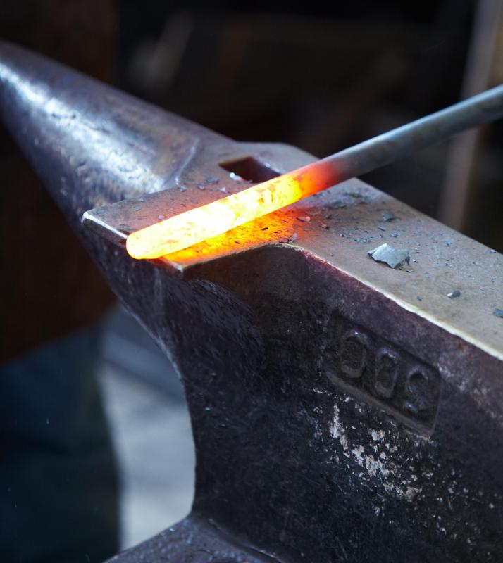 An accused often held a red hot iron rod while walking 9 feet during a trial by fire.
