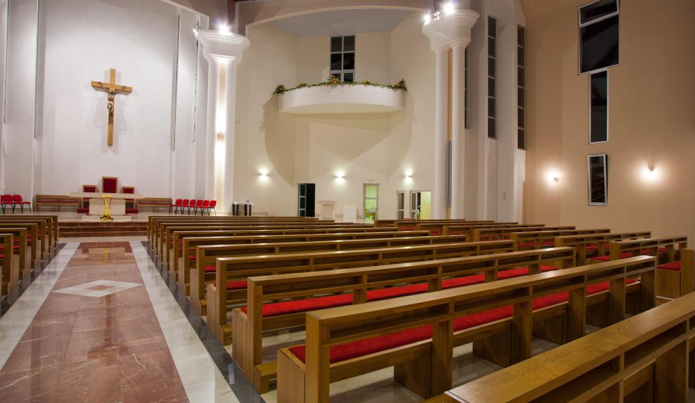 Inside a church, sound waves travel through the large space and bounce off the flat walls, which causes echoes.