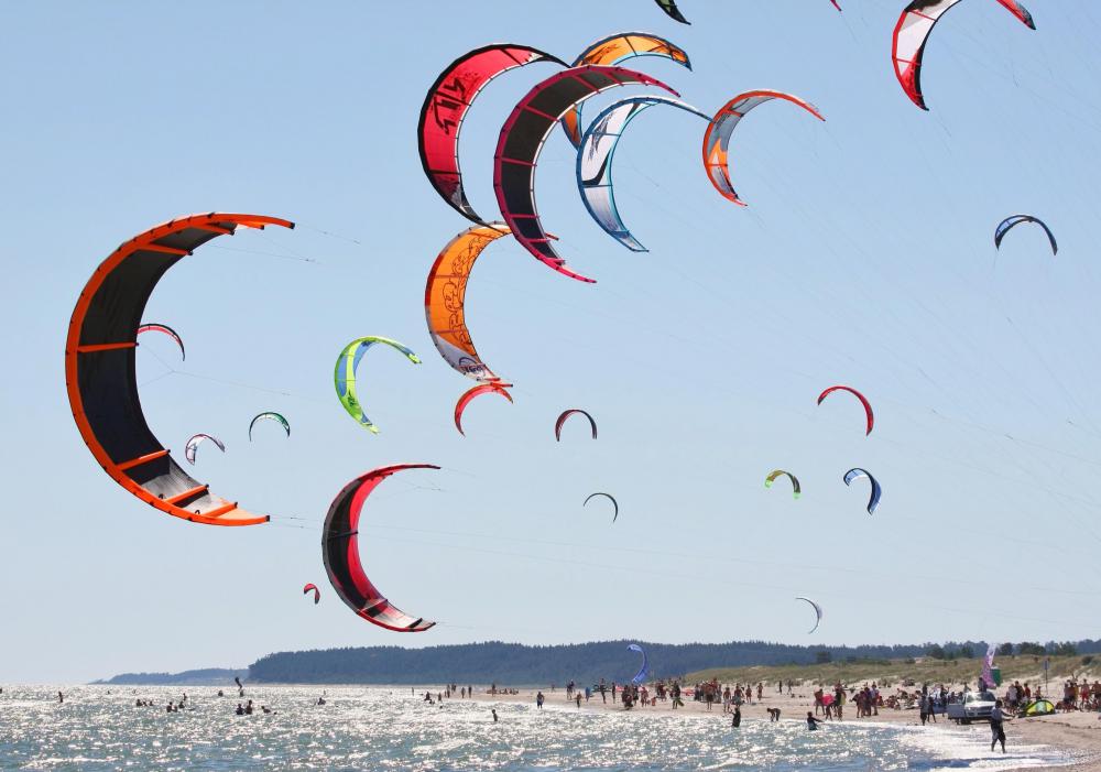 Kitesurfing is also known as kiteboarding, and is an exciting, popular sport in many seaside cities.