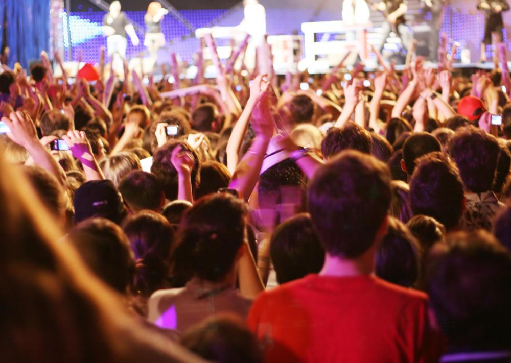 Modern concert audiences also scream and whistle between songs at shows.