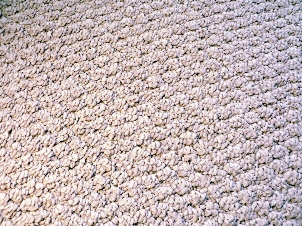 Widely looped carpets like berber do not react well to thick carpet padding.