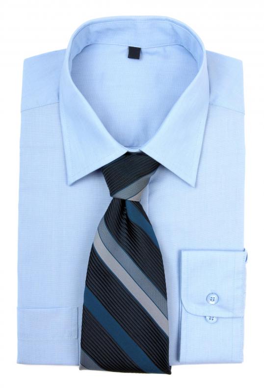 A dress shirt and tie are appropriate office attire for men at many companies.