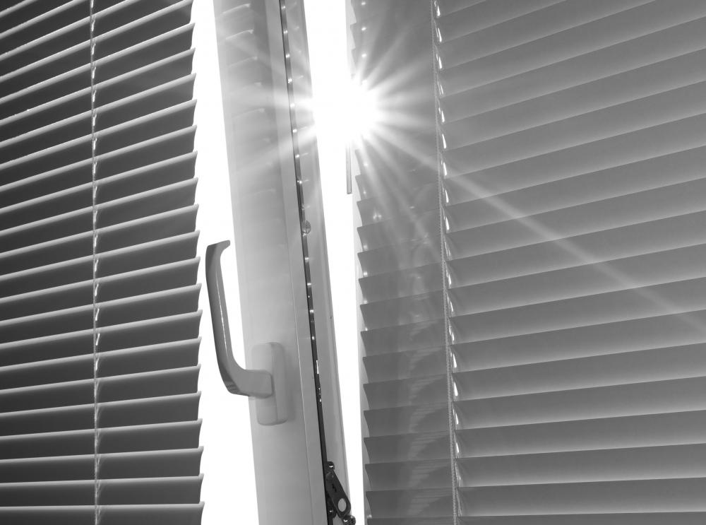 Window blinds should be closed on windows that face the sun to reduce the amount of heat that enters a room.