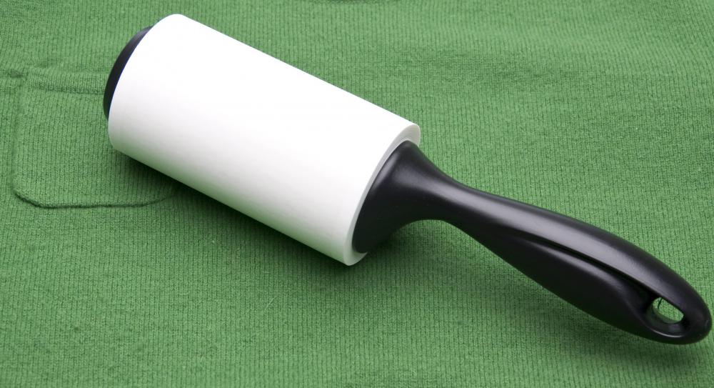 A lint roller may use sheets of sticky paper to pick up lint.