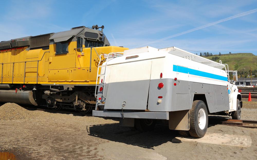 According to classical mechanics, the force exerted by an object is proportional to its mass, which is why cars receive the most damage in train-auto collisions.