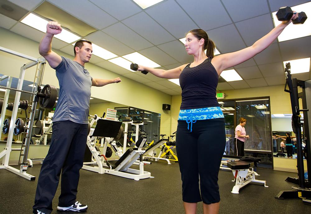 A personal trainer at the gym can help a contestant exercise in preparation for a pageant.