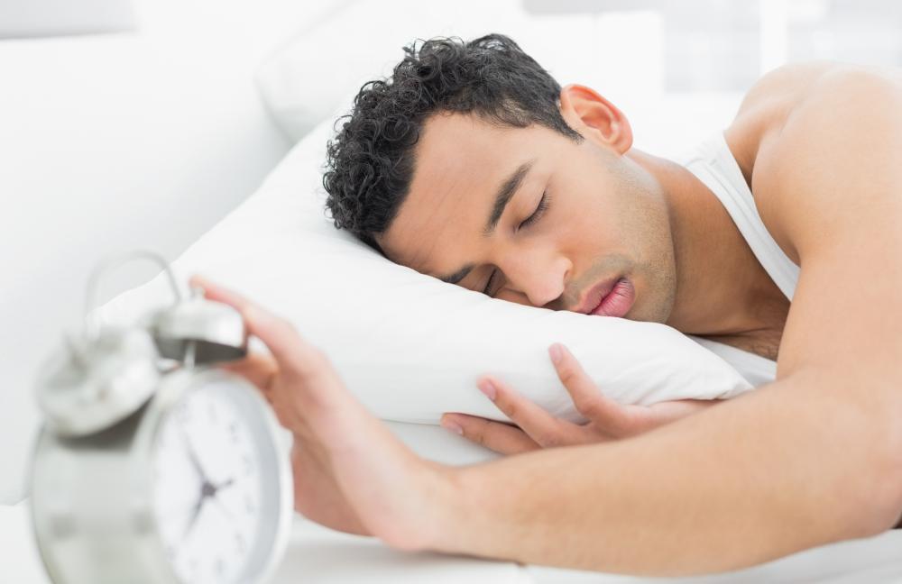 Moving the alarm clock away from the bed can prevent a person from hitting the snooze button too often.