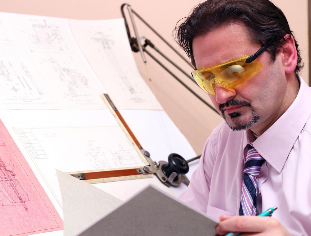 Drafting paper is typically mounted on a drafting table for an architect or artist to use.