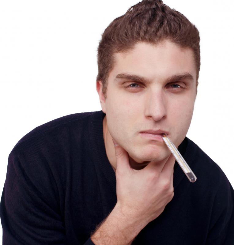A sore throat and a fever may be symptomatic of a swollen spleen that's caused by a viral infection.
