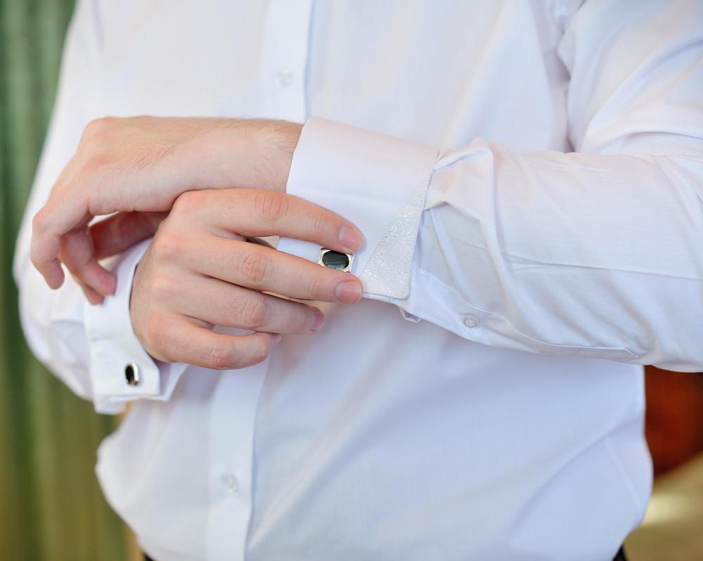 Many people wear cufflinks with a tuxedo shirt.