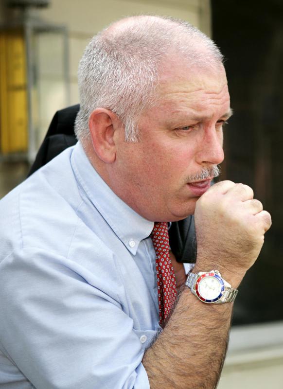 Individuals with a colloid goiter may experience coughing and difficulty swallowing.